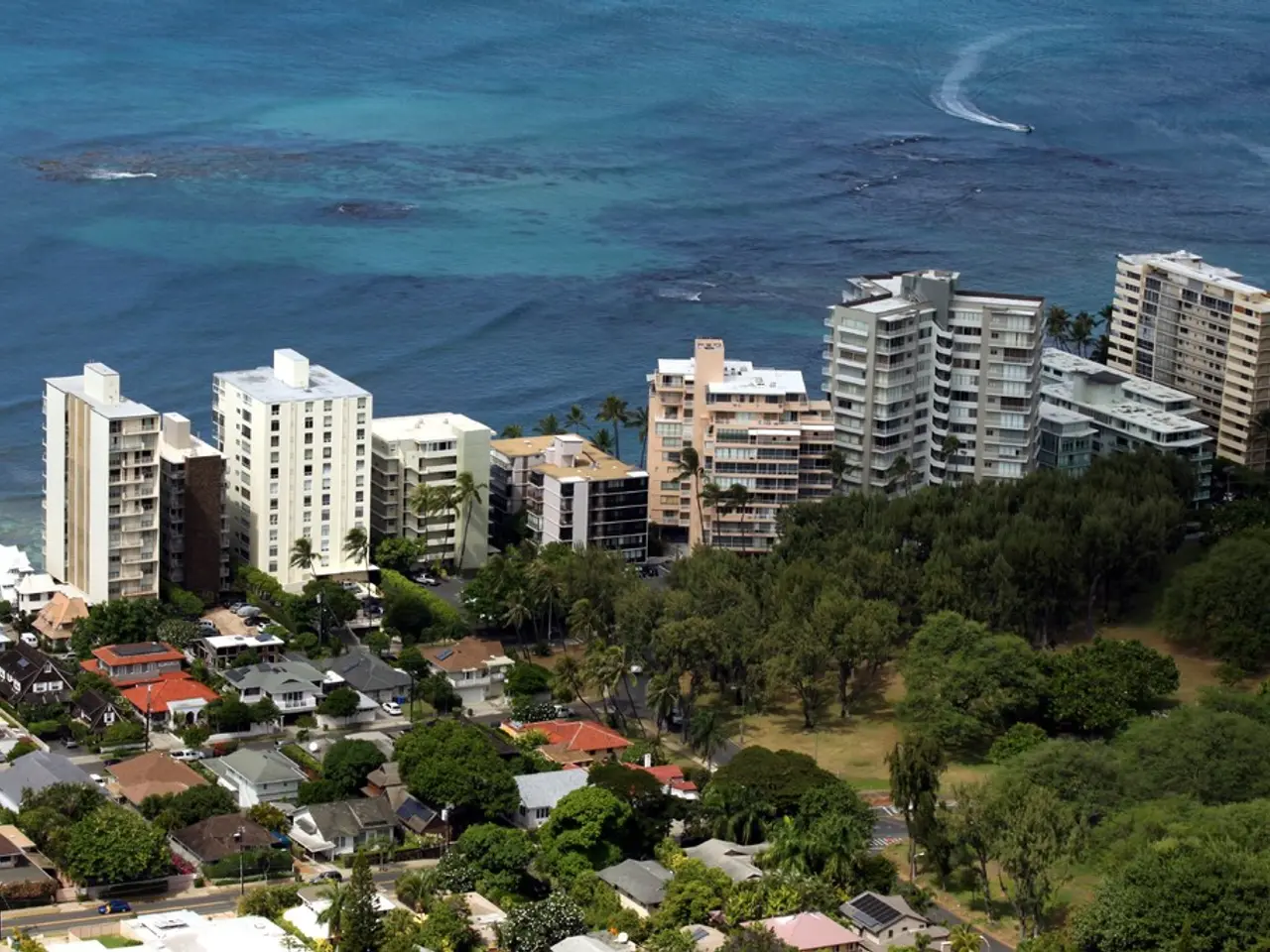 There are some boats and ships on the sea in the middle of this image, and there are some buildings...