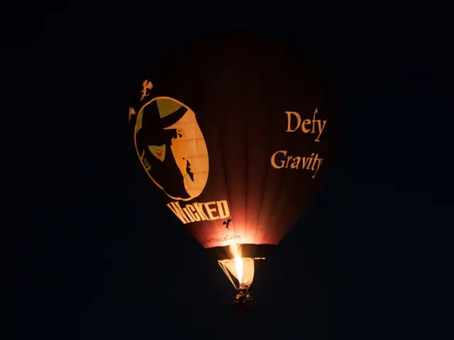 Illuminated hot air balloons with unique designs grace the night skies of Cappadocia during the...