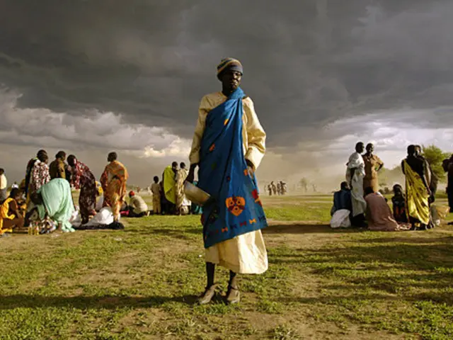 Stylish ensemble of Kate Middleton: a beachy blue dress, flat espadrilles, and eye-catching...